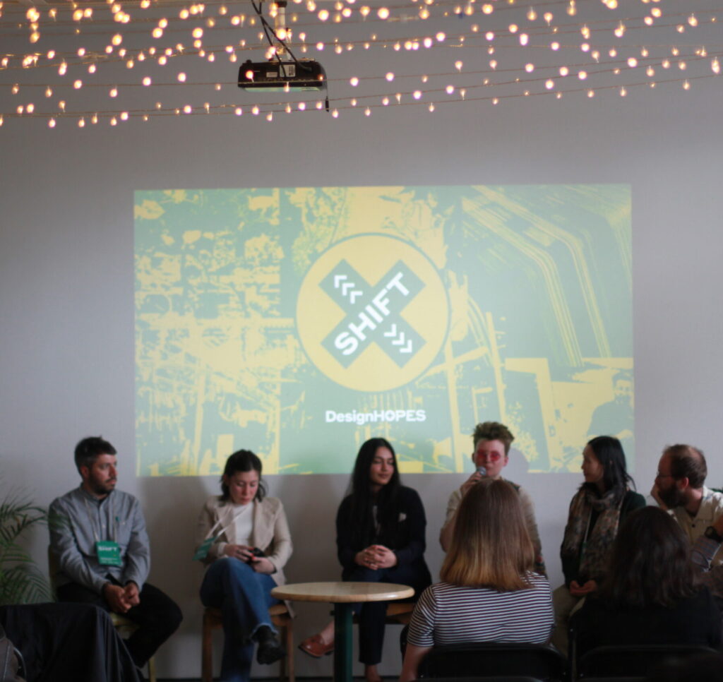 Design HOPES a photograph of Rosie speaking on a panel at Design SHIFT symposium